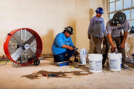 Workers at The Baker Hotel & Spa in Mineral Wells, Texas during construction keep their cool with a 36 in. Maxx Air drum fan.