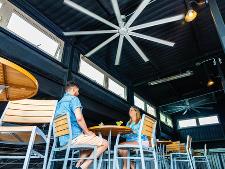 Patrons relax at Coffee and Cocktails in Mineral Wells underneath a Maxx Air 96 inch ceiling fan.