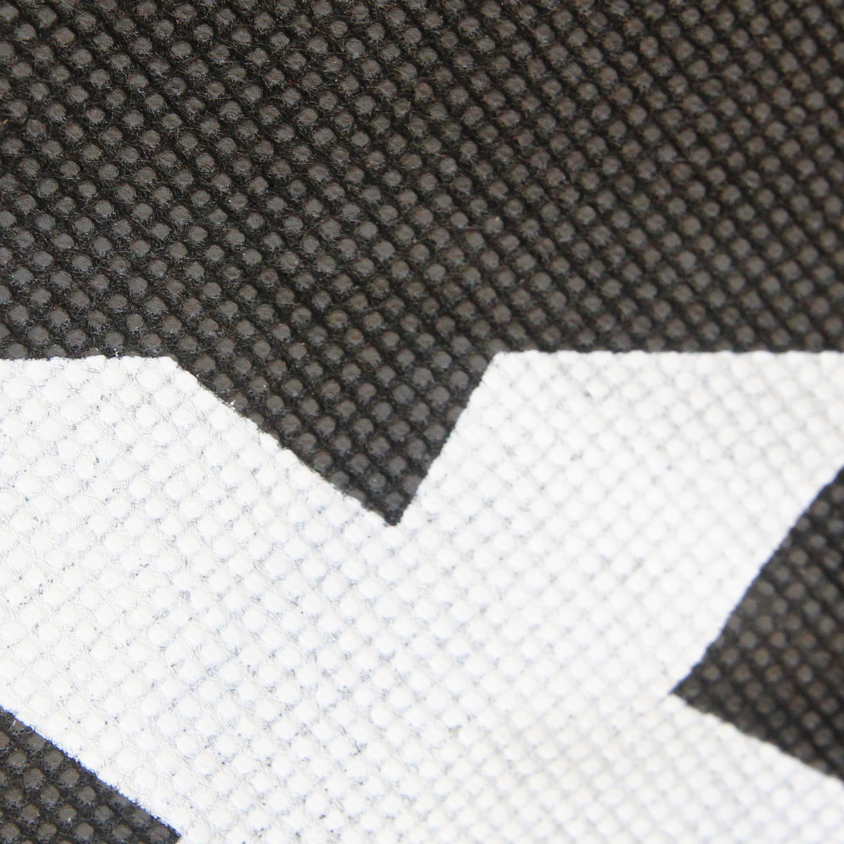 Detailed view of the black and printed polyester cover material.