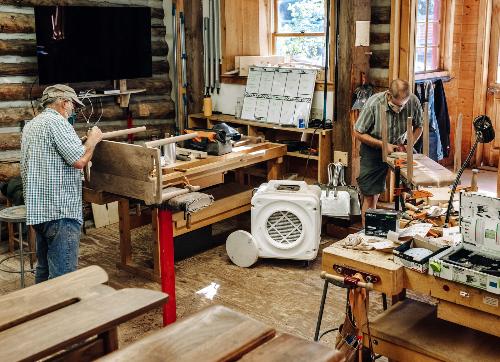 Guest Faculty Larry White and a student work on crafting benches during "The Maloof Experience: beyond the bench," a Summer 2021 Woodworking and Furniture Design workshop.