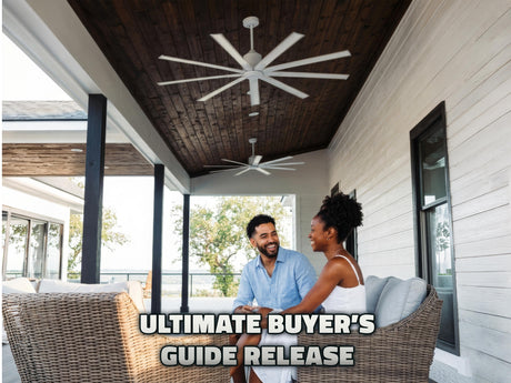 Couple sits on their covered porch, smiling and talking underneath the cool breeze of Maxx Air Industrial Indoor/Outdoor Ceiling Fans. 