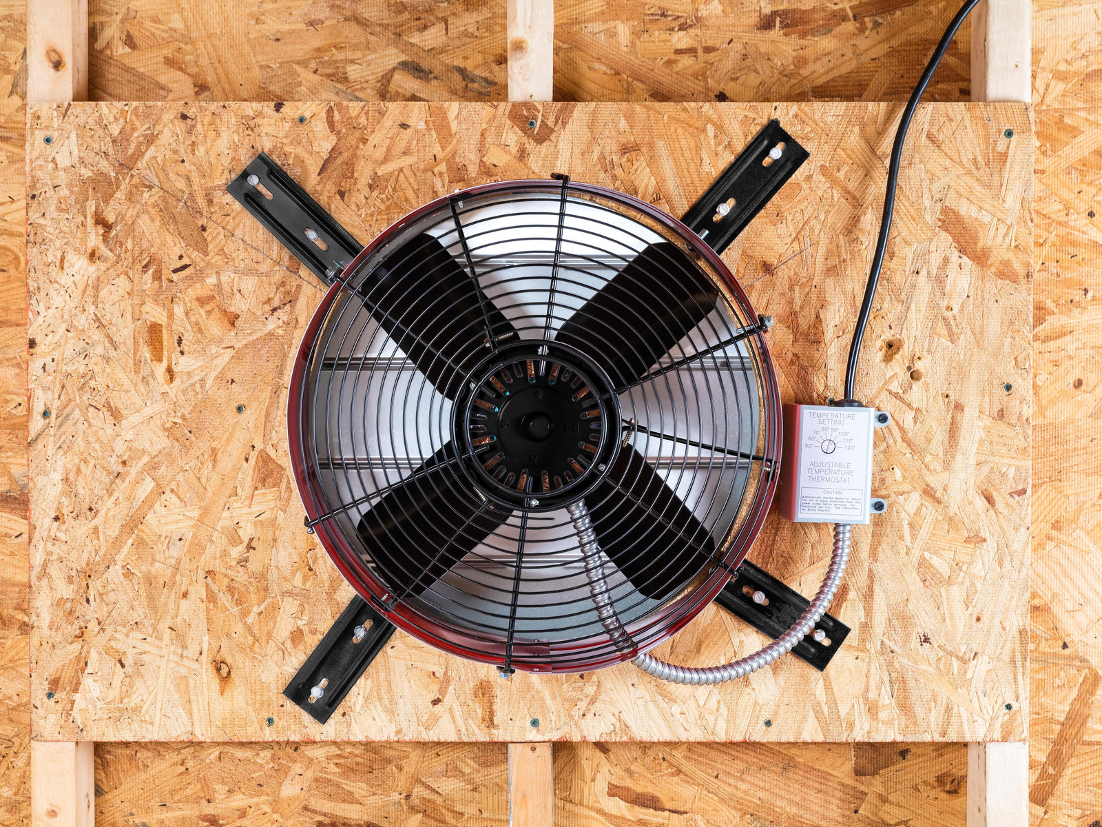 Image of a Maxx Air gable fan installed in an attic space for ventilation.