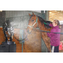 The Maxx Air misting cooling system provides comfort in the barn while a rider grooms their horse. 