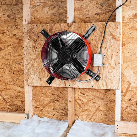 The premium exhaust fan in red installed in an attic gable end with the CX2121AM shutter to provide ventilation in your attic and protect your roofing components from heat damage. 