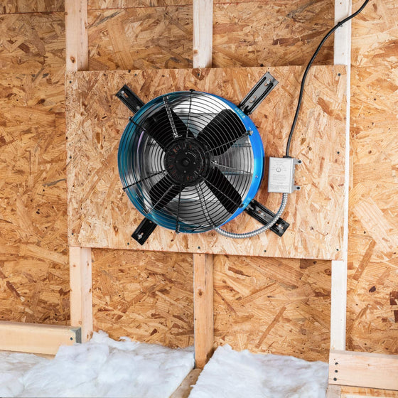 The premium exhaust fan in blue installed in an attic gable end with the CX2121AM shutter to provide ventilation in your attic and protect your roofing components from heat damage. 