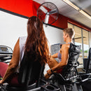 The Maxx Air 30" wall mount fan covers a large area of exercise bikes in a gym with it's sweeping oscillating design.